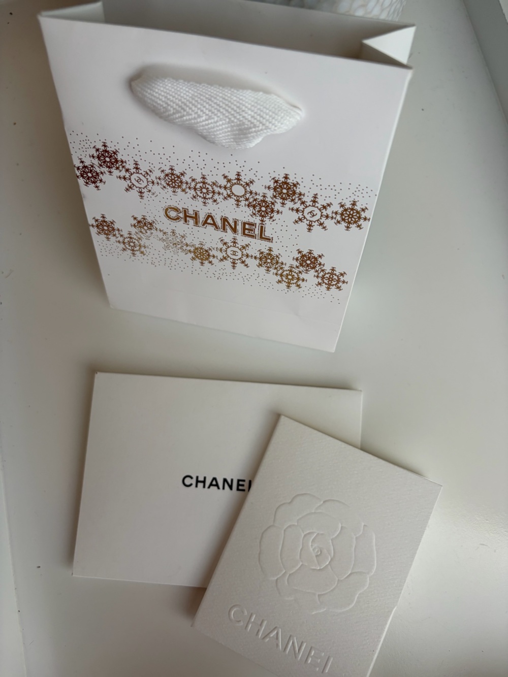 CHANEL White and Gold Snowflake Holiday Gift Bag